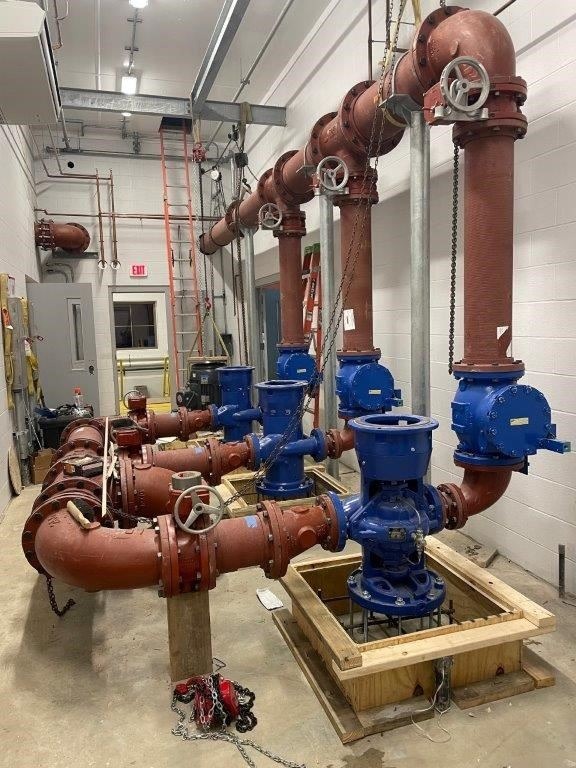 Installation of the Finish Water Pumps, Piping, and Concrete Pump Pads